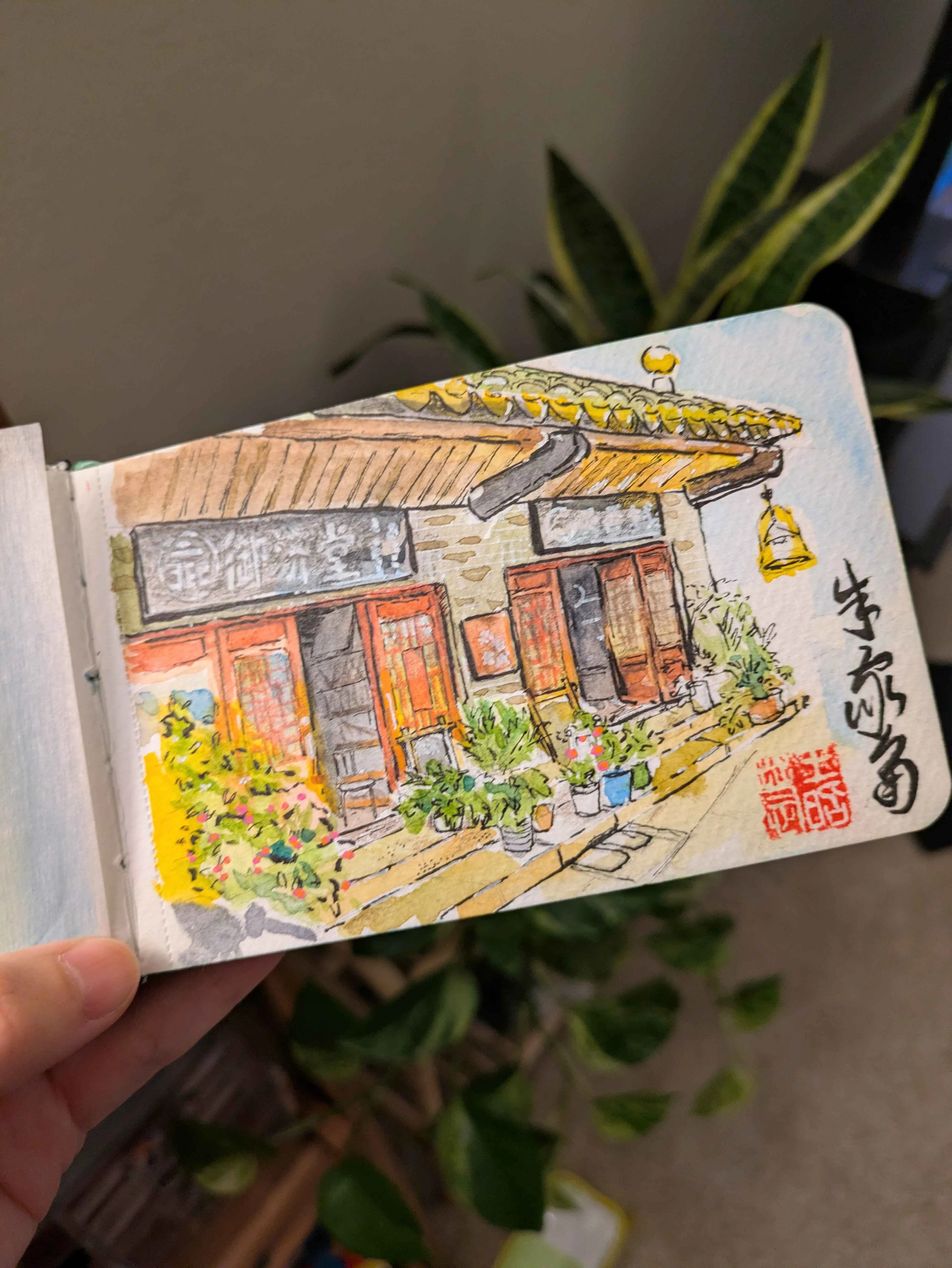 Watercolor sketch of a Taipei storefront in a sketchbook